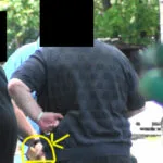 A man with a yellow outline pointing to his stomach.