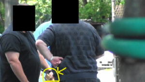 A man with a yellow outline pointing to his stomach.
