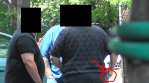 A man is seen in the back of another man 's head.