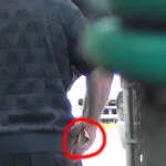 A man with a red circle around his finger.