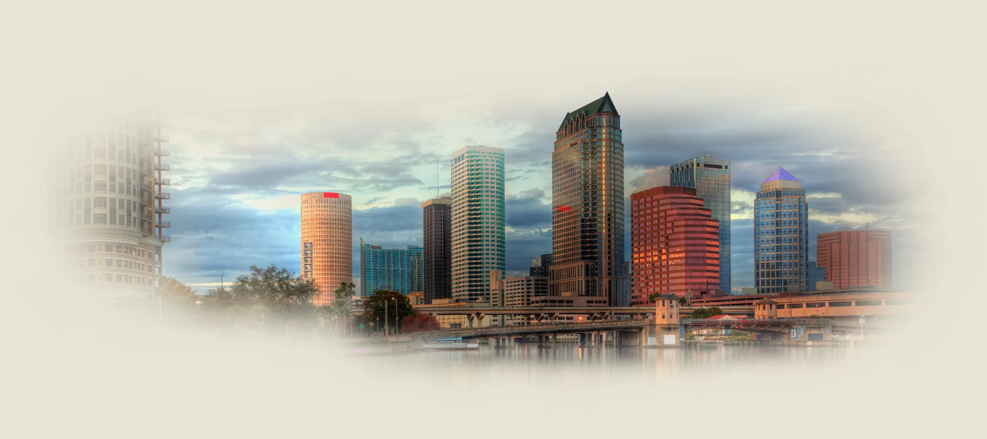 A painting of the tampa skyline with clouds in the background.